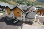 Discover this stunning modern chalet-style property nestled in a picturesque mountain setting.