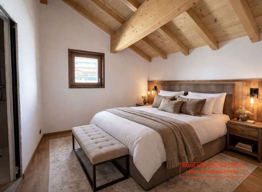 Experience luxury in this stunning bedroom featuring a cozy bed, elegant bench, and a warm, inviting atmosphere.