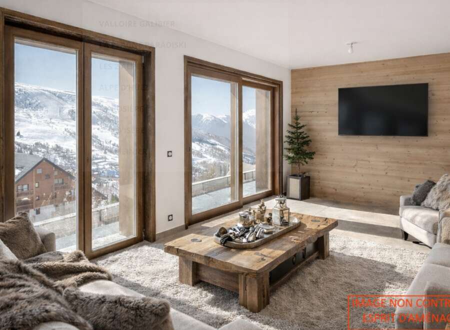 Experience luxury living in this stunning property, featuring breathtaking mountain views visible through expansive windows.