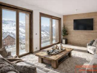 Experience luxury living in this stunning property, featuring breathtaking mountain views visible through expansive windows.