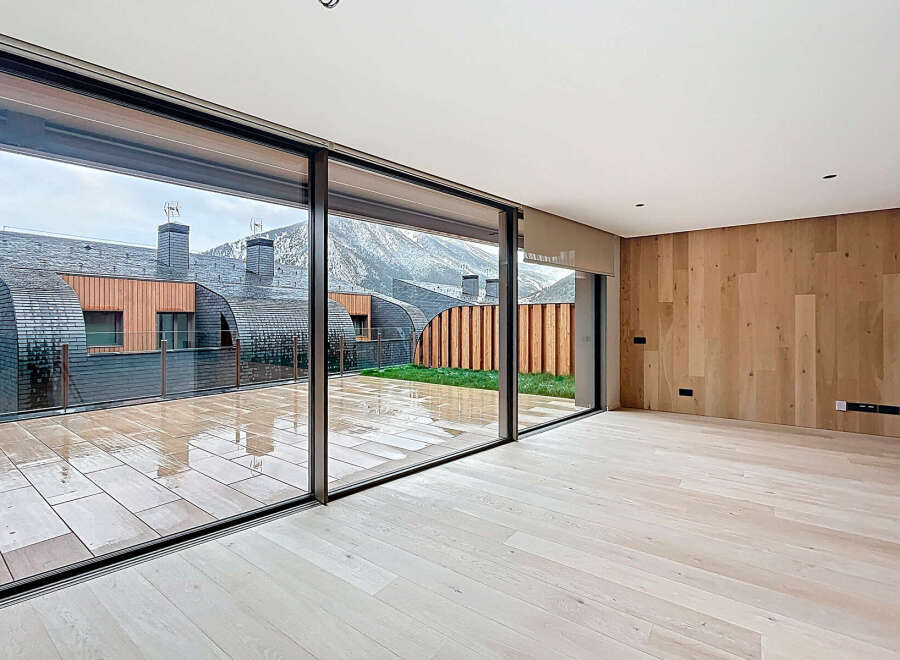 Experience luxury living with this stunning property featuring expansive windows that offer breathtaking views of the surrounding landscape.