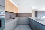 This modern kitchen boasts sleek, minimalist design with high-end finishes.