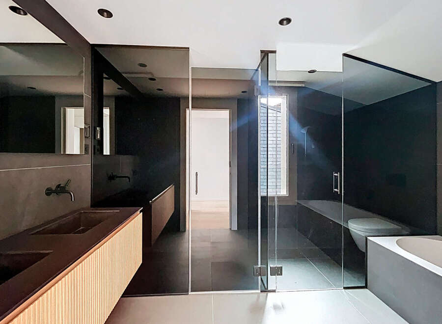 Step into modern luxury with this stunning bathroom design.