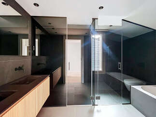 Step into modern luxury with this stunning bathroom design.