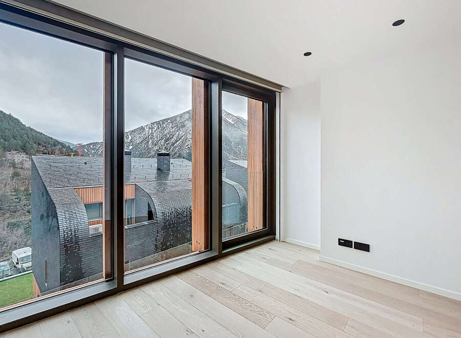 Experience breathtaking mountain views from this modern property.