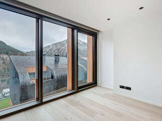 Experience breathtaking mountain views from this modern property.