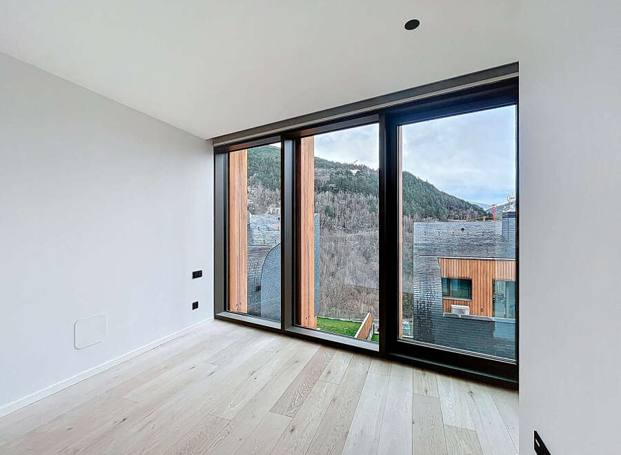 Experience breathtaking mountain views from this modern, light-filled room.
