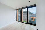 Experience breathtaking mountain views from this modern, light-filled room.