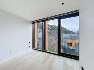 Experience breathtaking mountain views from this modern, light-filled room.