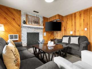 Step into a cozy living space with a rustic charm.