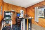 Step into a retro gaming paradise! This unique space features a Legends Pinball machine and a Mortal Kombat arcade game, perfect for endless entertainment.