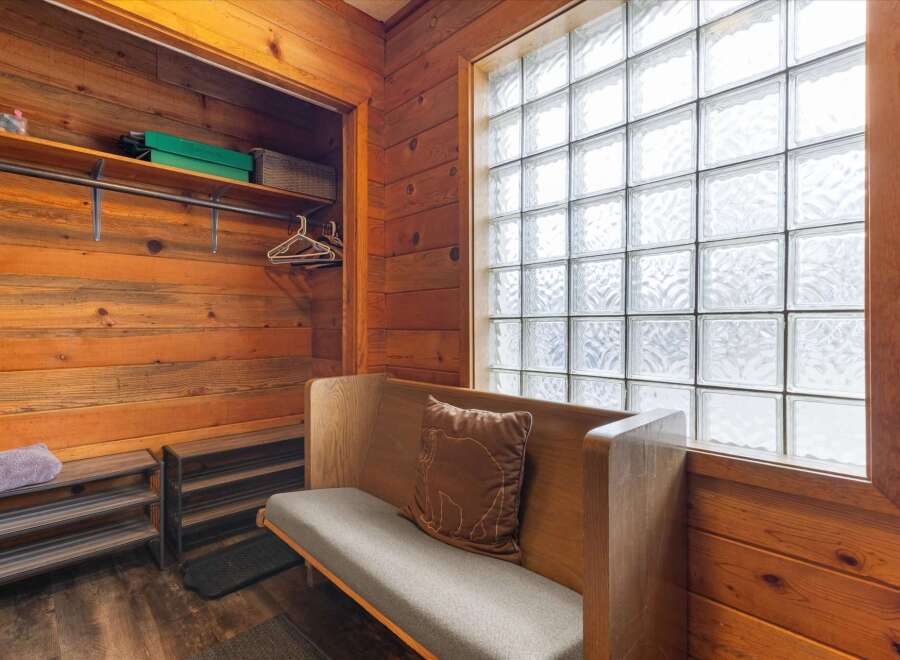 Step into this cozy space featuring a unique blend of rustic charm and modern comfort.