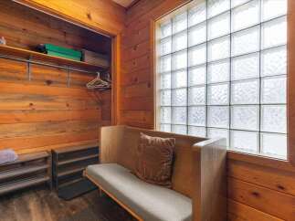 Step into this cozy space featuring a unique blend of rustic charm and modern comfort.
