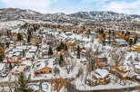 Nestled in a picturesque winter landscape, this property offers a charming retreat.