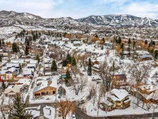 Nestled in a picturesque winter landscape, this property offers a charming retreat.
