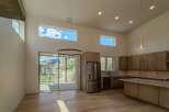 This stunning modern kitchen boasts high ceilings and an open floor plan, perfect for entertaining.