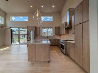 This stunning kitchen boasts a modern design with high-end finishes.