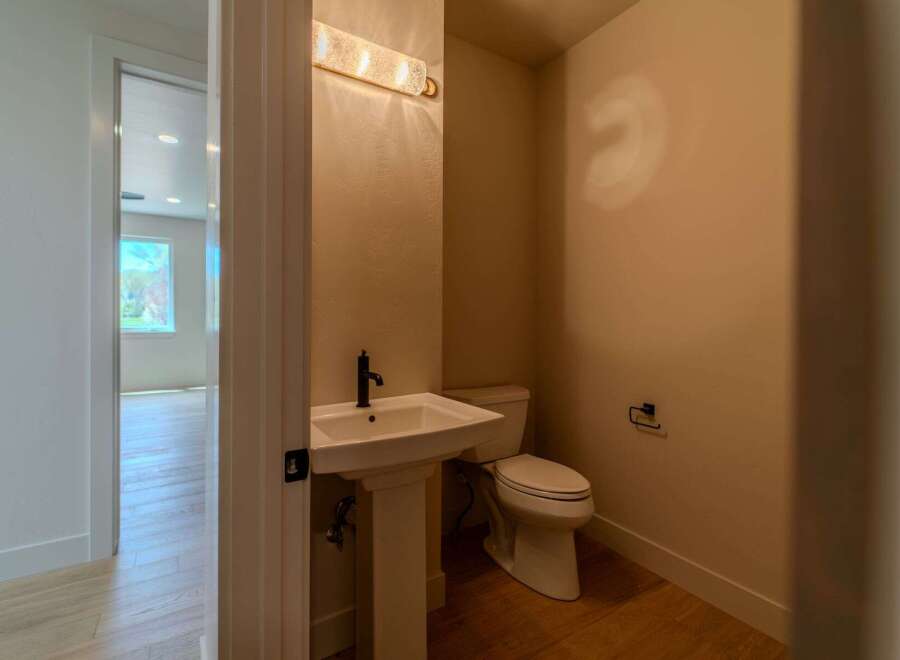 Step into this beautifully designed powder room, perfect for guests.