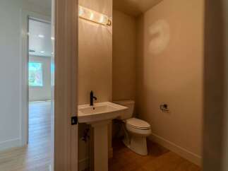 Step into this beautifully designed powder room, perfect for guests.