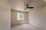 Step into this bright and airy room, featuring a modern ceiling fan and recessed lighting.