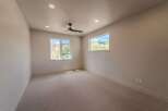 This spacious room offers a bright and airy atmosphere, perfect for relaxation or productivity.