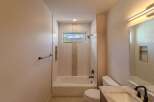 This stunning bathroom features a modern design with a beautiful view.