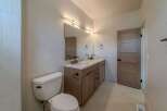 This stunning bathroom boasts a modern design with a double vanity and sleek fixtures.