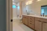Step into luxury with this stunning bathroom! Featuring a modern vanity with ample storage, a sleek mirror, and a bright, inviting atmosphere.