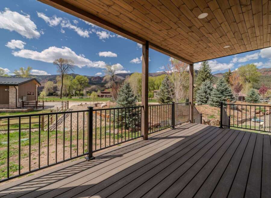 Enjoy breathtaking views from this stunning property! This home features a spacious deck, perfect for relaxing and entertaining.