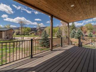 Enjoy breathtaking views from this stunning property! This home features a spacious deck, perfect for relaxing and entertaining.