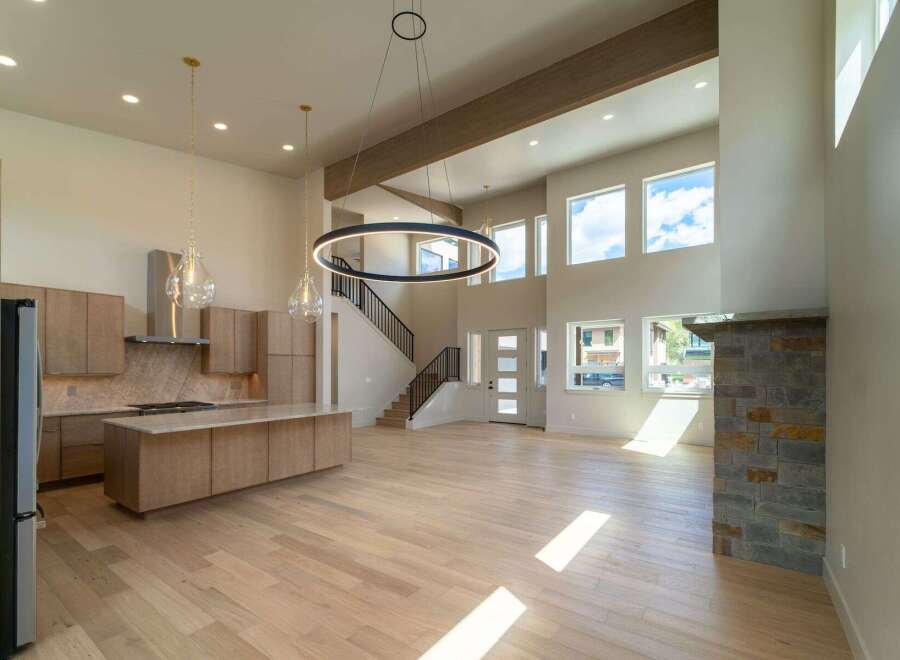 This stunning modern home boasts an open-concept design with soaring ceilings and abundant natural light.