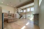 This stunning modern home boasts an open-concept design with soaring ceilings and abundant natural light.