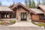 This stunning property boasts a rustic yet elegant design, featuring a beautiful stone facade and a welcoming entrance.