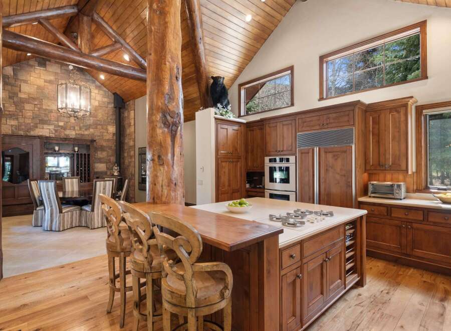 This stunning kitchen boasts a rustic yet elegant design, perfect for those seeking a luxurious living space.