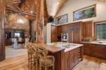 This stunning kitchen boasts a rustic yet elegant design, perfect for those seeking a luxurious living space.