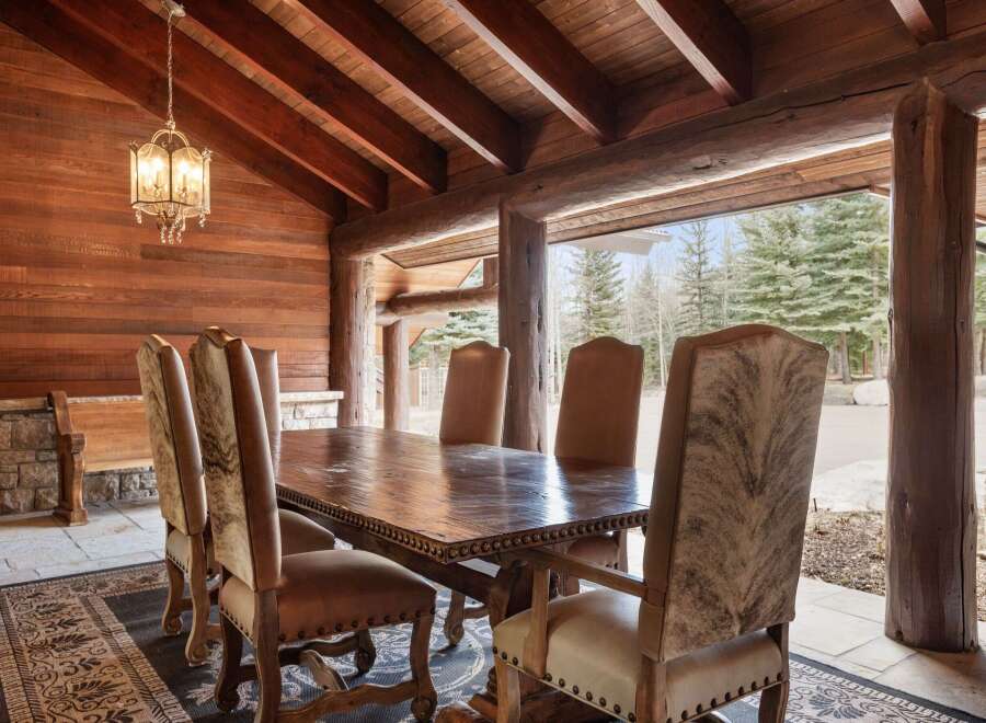 Step into rustic elegance with this stunning dining area.