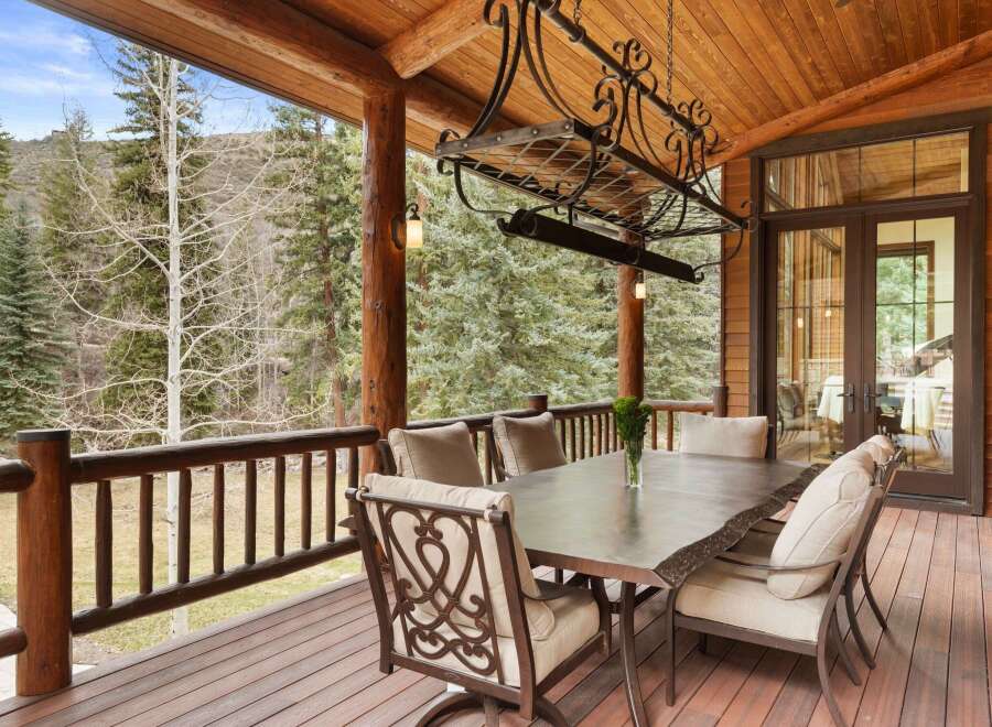 Enjoy the beauty of nature from this stunning outdoor dining area.