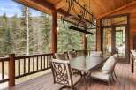 Enjoy the beauty of nature from this stunning outdoor dining area.
