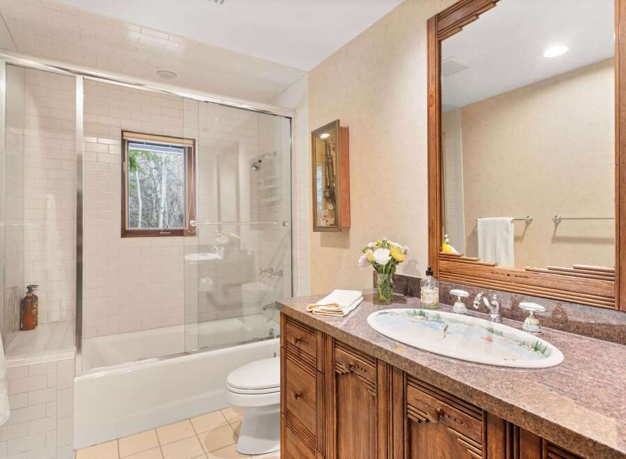 Step into a luxurious bathroom featuring a stunning combination of elegance and functionality.