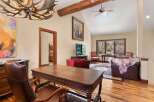 Step into luxury with this stunning property, featuring a spacious living area with a cozy fireplace and elegant hardwood floors.