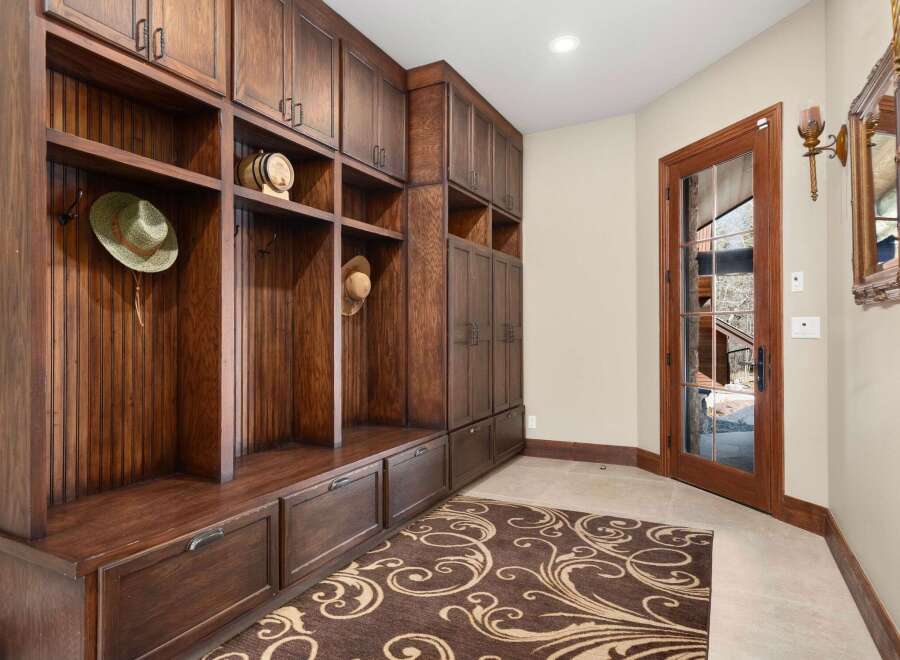 This stunning entryway boasts custom built-in storage, perfect for keeping your home organized.