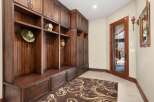 This stunning entryway boasts custom built-in storage, perfect for keeping your home organized.