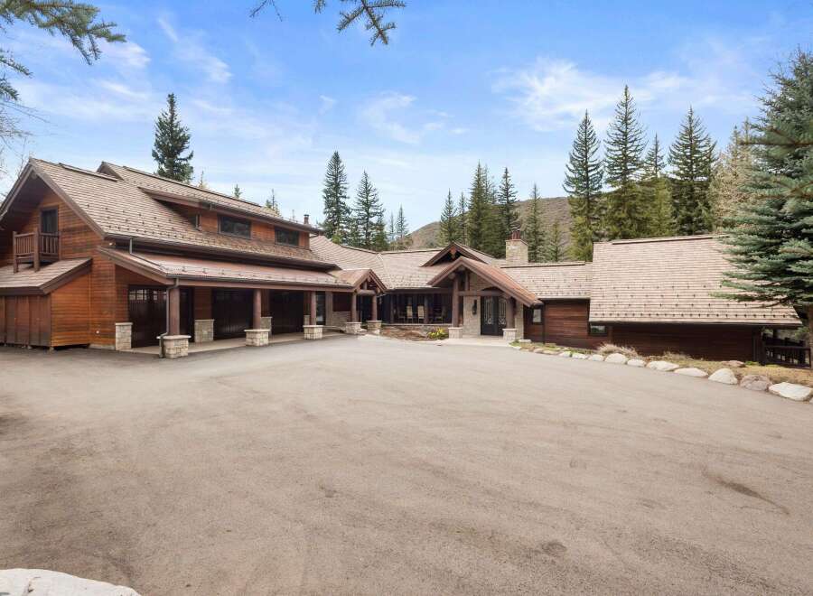 This stunning mountain home boasts exquisite wood detailing and a spacious layout, perfect for luxurious living.