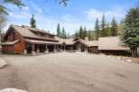 This stunning mountain home boasts exquisite wood detailing and a spacious layout, perfect for luxurious living.