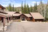 This stunning mountain home boasts a beautiful exterior with a blend of natural materials.