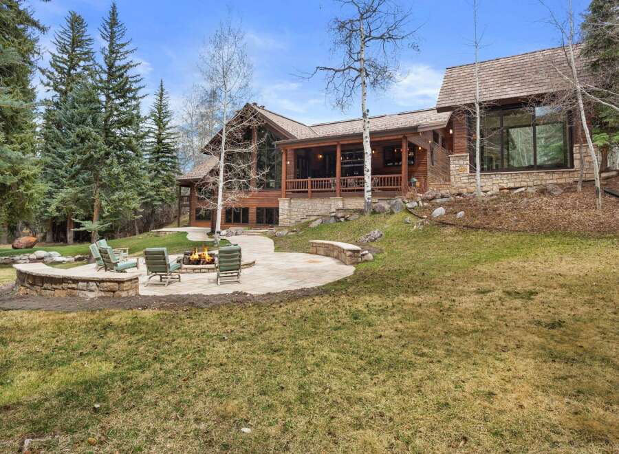 This stunning property boasts a luxurious outdoor living space, perfect for entertaining or relaxing.