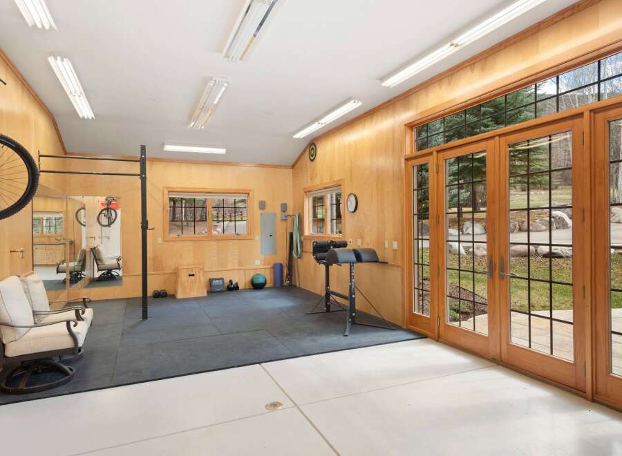 This stunning home gym offers a perfect blend of functionality and style, ideal for fitness enthusiasts.