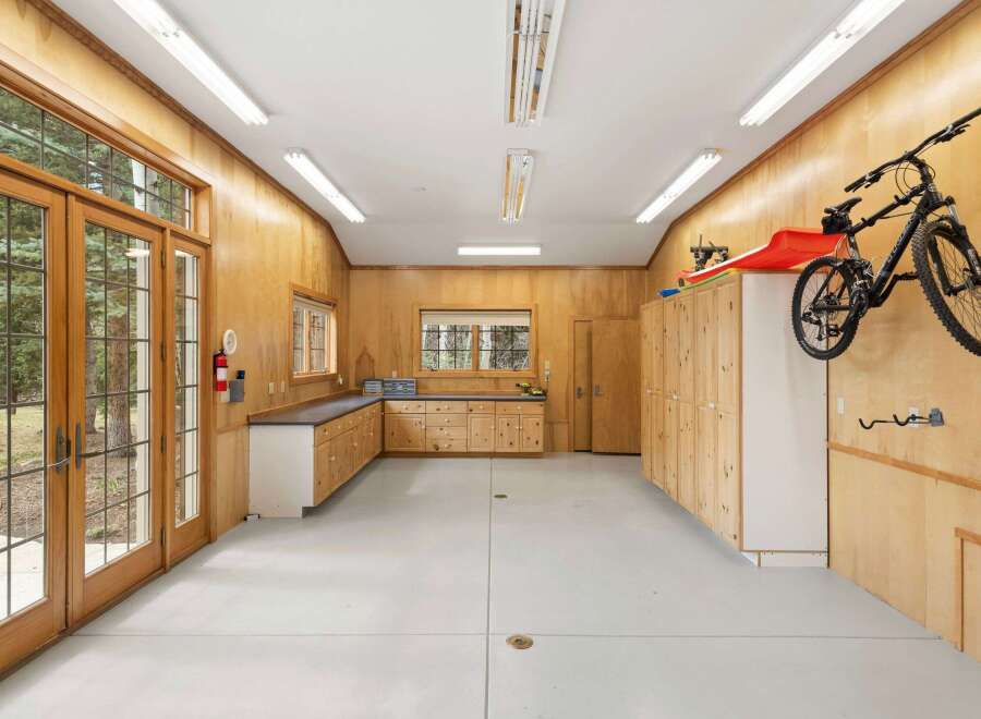 This spacious garage offers ample storage and workspace, perfect for any homeowner.