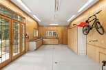 This spacious garage offers ample storage and workspace, perfect for any homeowner.