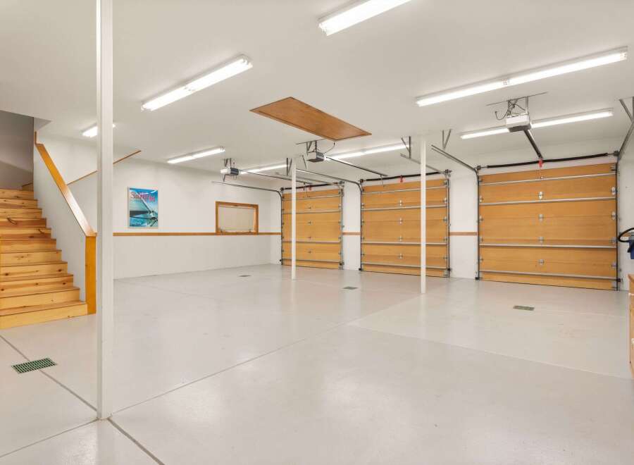 This spacious garage offers ample room for vehicles and storage.